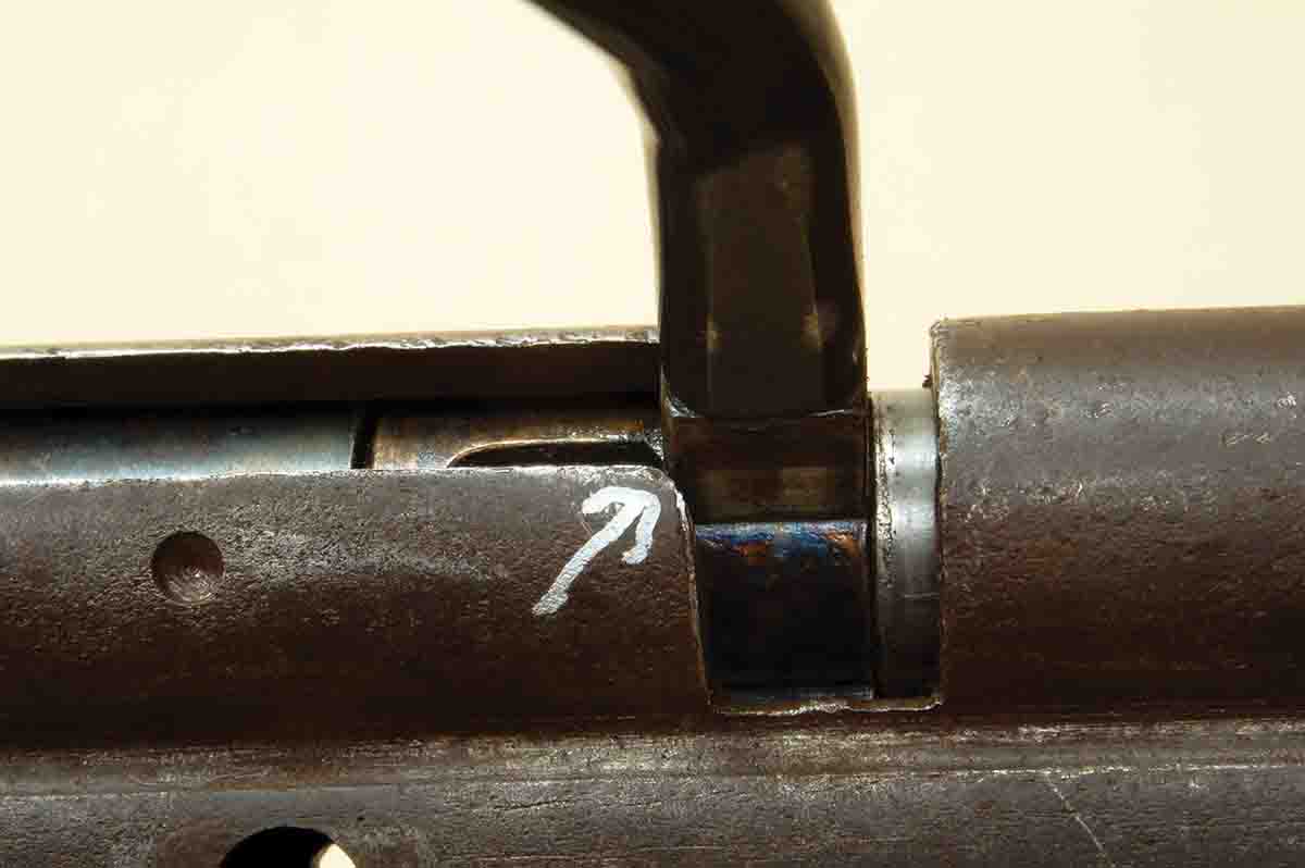 When the sear drops into the sear notch early in the worn bolt, the handle won’t go far enough forward (arrow) to go down into the locked position. It must be forced.